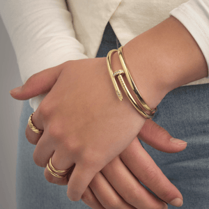 Bangle spijker steentjes goud