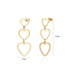 Drie hangende hartjes goud