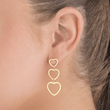 Drie hangende hartjes goud