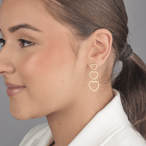 Drie hangende hartjes goud