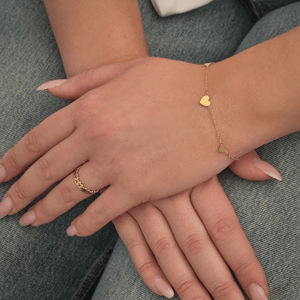 Drie hartjes armband goud