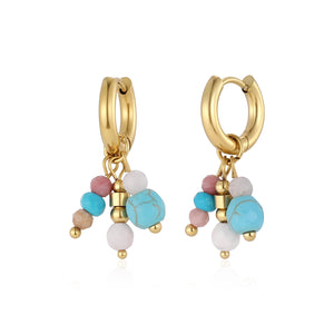 Oorbellen blauw gekleurde kralen goud