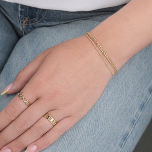 Tweelaags schakel & bolletjes goud