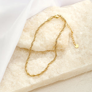 Gedraaide enkelband goud